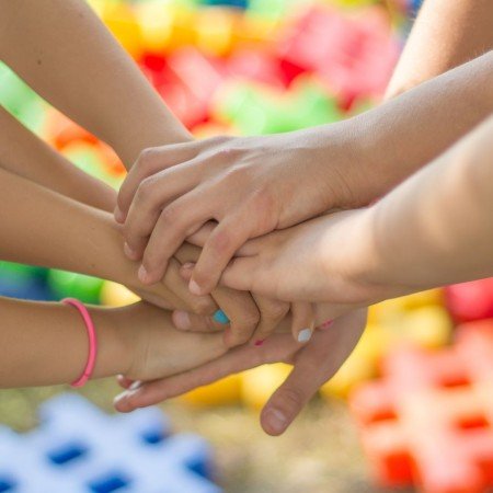 Children joining hands 